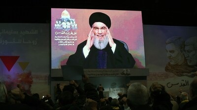 People watch the televised speech of Lebanon's Hezbollah chief Hasan Nasrallah. (AFP) People watch the televised speech of Lebanon's Hezbollah chief Hasan Nasrallah. (AFP)