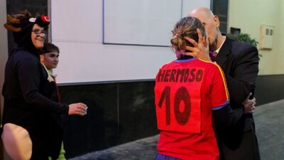 Fernando Rodriguez, 50, and his wife Rocio Garcia, 48, dressed up as the former president of Spanish Football Federation Luis Rubiales and Spain's player Jennifer Hermoso, pose for a photo depicting the controversy over a kiss (REUTERS)