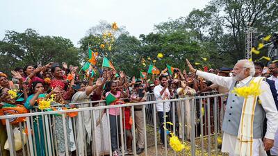 Prime Minister Narendra Modi waves to people as he holds a roadshow, in Thrissur on Wednesday (Narendra Modi-X) Prime Minister Narendra Modi waves to people as he holds a roadshow, in Thrissur on Wednesday (Narendra Modi-X)