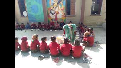 Students having midday meals at a government-run primary school in Prayagraj. (HT file) Students having midday meals at a government-run primary school in Prayagraj. (HT file)