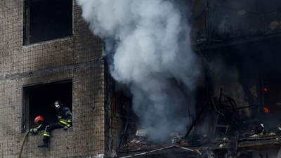 Firefighters work at the site of a residential building heavily damaged during a Russian missile attack, amid Russia's attack on Ukraine, in Kyiv, Ukraine. (REUTERS)