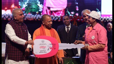 Uttar Pradesh chief minister Yogi Adityanath with the beneficiary of a government scheme during MSME mega loan distribution event in Lucknow on January 3. (Deeapk Gupta/HT) Uttar Pradesh chief minister Yogi Adityanath with the beneficiary of a government scheme during MSME mega loan distribution event in Lucknow on January 3. (Deeapk Gupta/HT)