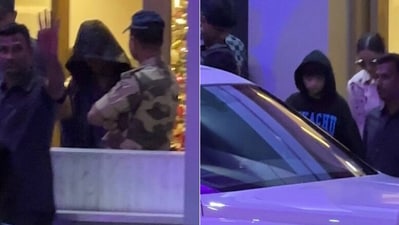 Shah Rukh Khan hides his face as he returns to Mumbai from New Year's holiday with wife Gauri Khan, Abram Shah Rukh Khan hides his face as he returns to Mumbai from New Year's holiday with wife Gauri Khan, Abram