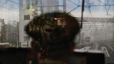 A Yamanote Line train conductor sits in a control room as another Yamanote Line train approaches. (Representational)