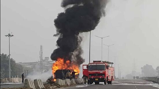 Firefighting operations underway on the elevated road in Khanna, Ludhiana. (HT Photo)