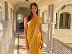 Karlie Kloss wore a yellow saree from Anita Dongre for a Haldi function in Udaipur. 