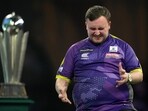 Luke Littler grimaces during the final match against Luke Humphries.