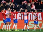 Girona's Spanish midfielder Ivan Martin (2R) celebrates with teammates 