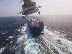 FILE PHOTO: Houthi military helicopter flies over the Galaxy Leader cargo ship in the Red Sea in this photo released November 20, 2023. Houthi Military Media/Handout via REUTERS//File Photo
