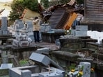 A man who lost his house in the earthquake reacts as he visits the graveyards of his parents, which were rattled by the earthquake, in Wajima, Japan, January 4, 2024.