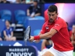 Serbia's Novak Djokovic hits a return against Australia's Alex de Minaur Serbia's Novak Djokovic hits a return against Australia's Alex de Minaur
