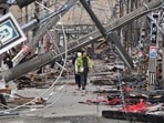 People walk past fallen utility poles and damaged buildings in the city of Wajima, Ishikawa prefecture on January 4, 2024, after a major 7.5 magnitude earthquake struck the Noto region in Ishikawa prefecture on New Year's Day. More than 50 people were reported missing on January 4 as Japanese rescuers battled to reach hundreds still cut off from help three days after a devastating earthquake left at least 78 dead. People walk past fallen utility poles and damaged buildings in the city of Wajima, Ishikawa prefecture on January 4, 2024, after a major 7.5 magnitude earthquake struck the Noto region in Ishikawa prefecture on New Year's Day. More than 50 people were reported missing on January 4 as Japanese rescuers battled to reach hundreds still cut off from help three days after a devastating earthquake left at least 78 dead.