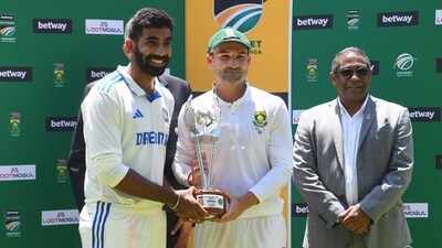 India's Jasprit Bumrah (L) and South Africa's Dean Elgar (C) hold the trophy for players of the series at Newlands stadium in Cape Town. (AFP) India's Jasprit Bumrah (L) and South Africa's Dean Elgar (C) hold the trophy for players of the series at Newlands stadium in Cape Town. (AFP)