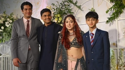 After the wedding ceremony, newlyweds Ira Khan and Nupur Shikhare were seen posing with their family members. Fitness coach and athlete Nupur Shikhare and Ira seen with her brothers Azad Rao Khan (extreme right) and Junaid Khan (extreme left). Junaid is Aamir's son from his first marriage, and Azad is his son from his second marriage. (AFP) After the wedding ceremony, newlyweds Ira Khan and Nupur Shikhare were seen posing with their family members. Fitness coach and athlete Nupur Shikhare and Ira seen with her brothers Azad Rao Khan (extreme right) and Junaid Khan (extreme left). Junaid is Aamir's son from his first marriage, and Azad is his son from his second marriage. (AFP)