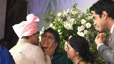 Aamir Khan was seen planting a kiss on Kiran Rao’s cheek as they posed for the cameras at Ira Khan’s wedding. Aamir Khan’s daughter Ira married boyfriend Nupur Shikhare in Mumbai on Thursday, January 3. The actor was seen posing with the newly married couple and his ex wives, Reena Dutta and Kiran. (AFP) Aamir Khan was seen planting a kiss on Kiran Rao’s cheek as they posed for the cameras at Ira Khan’s wedding. Aamir Khan’s daughter Ira married boyfriend Nupur Shikhare in Mumbai on Thursday, January 3. The actor was seen posing with the newly married couple and his ex wives, Reena Dutta and Kiran. (AFP)