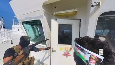 File Photo: Houthi fighters open the door of the cockpit on the ship's deck in the Red Sea in this photo released November 20, 2023. (via REUTERS/Representative Image)