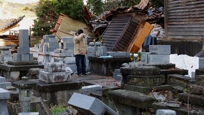 A man who lost his house in the earthquake reacts as he visits the graveyards of his parents, which were rattled by the earthquake, in Wajima, Japan, January 4, 2024. (Reuters)