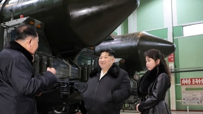 North Korean leader Kim Jong Un, accompanied by his daughter Kim Ju Ae, visits a military vehicle production plant. (via REUTERS)