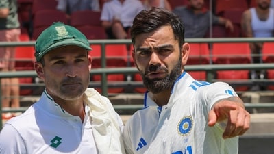 Dean Elgar of South Africa, left, and Virat Kohli of India after India won the second test match against South Africa by 7 wickets in Cape Town (AP)
