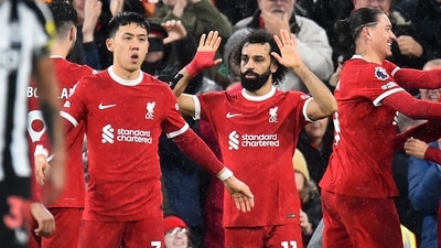 Mohamed Salah celebrates with teammates after scoring the opening goal of the English Premier League football match between Liverpool and Newcastle United at Anfield in Liverpool (AFP) Mohamed Salah celebrates with teammates after scoring the opening goal of the English Premier League football match between Liverpool and Newcastle United at Anfield in Liverpool (AFP)