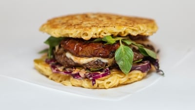 The Ramen Burger from New York: The Ramen Burger is a unique food item that gained popularity in New York City. It features a beef patty sandwiched between two buns made from compressed ramen noodles, creating a fusion of Japanese and American flavours. (Unsplash) The Ramen Burger from New York: The Ramen Burger is a unique food item that gained popularity in New York City. It features a beef patty sandwiched between two buns made from compressed ramen noodles, creating a fusion of Japanese and American flavours. (Unsplash)