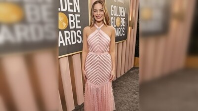 Margot Robbie turned heads in a slinky pink custom Chanel halter neck dress, reportedly crafted over 750 hours. (Pinterest) Margot Robbie turned heads in a slinky pink custom Chanel halter neck dress, reportedly crafted over 750 hours. (Pinterest)