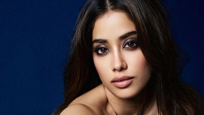 Janhvi Kapoor in a halter dress with a crystal butterfly embellishment Janhvi Kapoor in a halter dress with a crystal butterfly embellishment