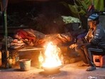 People sitting around bonfire to protect themselves from cold wave during winter season in Patna, Bihar (File) 