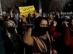 Afghan women chant slogans in protest against the closure of universities to women by the Taliban in Kabul, Afghanistan, December 22, 2022. 
