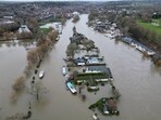 An aerial view shows properties surrounded by floodwater, in the aftermath of Storm Henk, on an island in the River Thames at Henley-on-Thames, Britain, January 5, 2024. Britain suffers serious travel disruption as major rivers burst banks, homes damaged amid flood chaos 