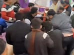 People gathered at the felicitation ceremony of Rajasthan minister help him to get up after he and others fell down.
