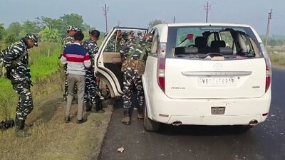 North 24 Parganas: Security personnel inspect a vehicle of the Enforcement Directorate (ED) team which was attacked during a raid in West Bengal's Sandeshkhali, in North 24 Parganas on Friday. (ANI) North 24 Parganas: Security personnel inspect a vehicle of the Enforcement Directorate (ED) team which was attacked during a raid in West Bengal's Sandeshkhali, in North 24 Parganas on Friday. (ANI)