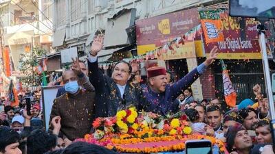 BJP national president JP Nadda along with BJP state chief Rajeev Bindal and former chief minister Jai Ram Thakur during a road show at Solan’s Mall Road on Friday. (HT Photo) BJP national president JP Nadda along with BJP state chief Rajeev Bindal and former chief minister Jai Ram Thakur during a road show at Solan’s Mall Road on Friday. (HT Photo)