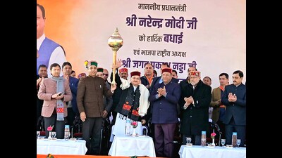 BJP national president JP Nadda holds a mace during a public meeting in Shimla on Friday. (ANI) BJP national president JP Nadda holds a mace during a public meeting in Shimla on Friday. (ANI)