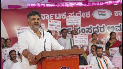 Bengaluru: Karnataka Deputy Chief Minister DK Shivakumar addresses Congress leaders and workers during a protest over the suspension of opposition MPs from Parliament during the Winter session, in Bengaluru, Friday, Dec. 22, 2023. (PTI Photo/Shailendra Bhojak) (PTI12_22_2023_000116B) (PTI) Bengaluru: Karnataka Deputy Chief Minister DK Shivakumar addresses Congress leaders and workers during a protest over the suspension of opposition MPs from Parliament during the Winter session, in Bengaluru, Friday, Dec. 22, 2023. (PTI Photo/Shailendra Bhojak) (PTI12_22_2023_000116B) (PTI)