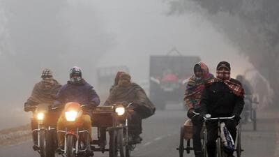 Commuters braving the chill in Amritsar as the temperature dipped to 6.6°C on Friday. (ANI Photo)