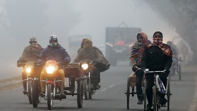 Commuters travel amid a cold and foggy weather in Amritsar on Thursday. (ANI) Commuters travel amid a cold and foggy weather in Amritsar on Thursday. (ANI)