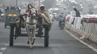 Delhi and the National Capital Region remained in the grip of a cold spell on Friday morning, with Safdarjung, Delhi's main weather station, recording a minimum temperature of 9.4 degrees Celsius, which is 2.5 degrees Celsius below the normal range. (AFP) Delhi and the National Capital Region remained in the grip of a cold spell on Friday morning, with Safdarjung, Delhi's main weather station, recording a minimum temperature of 9.4 degrees Celsius, which is 2.5 degrees Celsius below the normal range. (AFP)