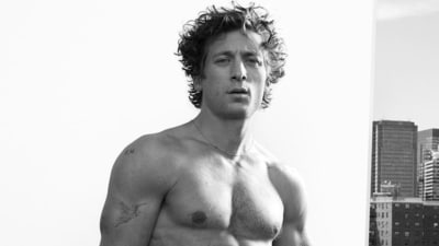 In one black-and-white photo, Jeremy Allen White stares into the camera. In another picture, he slinks down on a couch, presumably on a rooftop, with other buildings in the distance. His jeans are partially pulled down, exposing his Calvin Klein underwear. In one black-and-white photo, Jeremy Allen White stares into the camera. In another picture, he slinks down on a couch, presumably on a rooftop, with other buildings in the distance. His jeans are partially pulled down, exposing his Calvin Klein underwear.