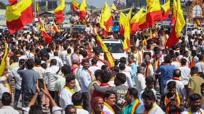 Bengaluru: Activists of the Karnataka Rakshana Vedike (Narayana Gowda faction) during a rally over the 60 per cent Kannada sign board rules, in Bengaluru, Wednesday, Dec. 27, 2023. The organisation on Wednesday targeted business establishments in Bengaluru and damaged their signboards and name plates which did not use Kannada. (PTI Photo) (PTI12_27_2023_000190B) (PTI) Bengaluru: Activists of the Karnataka Rakshana Vedike (Narayana Gowda faction) during a rally over the 60 per cent Kannada sign board rules, in Bengaluru, Wednesday, Dec. 27, 2023. The organisation on Wednesday targeted business establishments in Bengaluru and damaged their signboards and name plates which did not use Kannada. (PTI Photo) (PTI12_27_2023_000190B) (PTI)