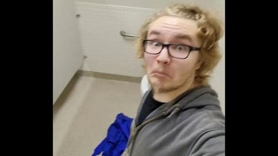 Dylan Butler, before the shooting, shared a TikTok of himself in what seemed like the school bathroom stall, captioning it: "Now we wait" (Tooktoomuch/TikTok) Dylan Butler, before the shooting, shared a TikTok of himself in what seemed like the school bathroom stall, captioning it: "Now we wait" (Tooktoomuch/TikTok)