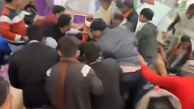 People gathered at the felicitation ceremony of Rajasthan minister help him to get up after he and others fell down. (PTI) People gathered at the felicitation ceremony of Rajasthan minister help him to get up after he and others fell down. (PTI)