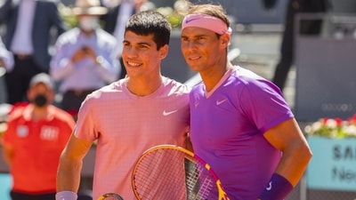 Rafael Nadal and Carlos Alcaraz pose for a photograph. Rafael Nadal and Carlos Alcaraz pose for a photograph.
