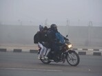 Students are going to school amid cold and dense foggy weather at South West Delhi near Samalka red light, in New Delhi, India, on Wednesday, 27 December 2023. (Photo by Parveen Kumar/Hindustan Times) Students are going to school amid cold and dense foggy weather at South West Delhi near Samalka red light, in New Delhi, India, on Wednesday, 27 December 2023. (Photo by Parveen Kumar/Hindustan Times)