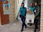 Officials carry ballot boxes for distribution to the voting centres as part of election preparation, a day ahead of the general election in Dhaka, Bangladesh.