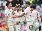 Australia's Pat Cummins (L) celebrates the wicket of Pakistan's Sajid Khan with teammates during the first day of the third cricket Test match against Australia at the Sydney Cricket Ground Australia's Pat Cummins (L) celebrates the wicket of Pakistan's Sajid Khan with teammates during the first day of the third cricket Test match against Australia at the Sydney Cricket Ground