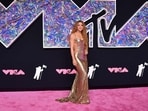 Colombian singer Shakira arrives for the MTV Video Music Awards at the Prudential Center. Shakira made heads turn on the pink carpet in a golden slip gown featuring backless detailing and a floor-sweeping train on the back. Her goddess-like locks accentuated the look. Colombian singer Shakira arrives for the MTV Video Music Awards at the Prudential Center. Shakira made heads turn on the pink carpet in a golden slip gown featuring backless detailing and a floor-sweeping train on the back. Her goddess-like locks accentuated the look. 