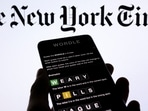 Wordle app game is seen on a smartphone.