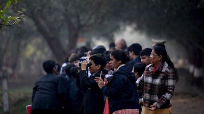 School students watching Migratory birds at Surajpur wetland, in Greater Noida, India, (Photo by Sunil Ghosh / Hindustan Times) School students watching Migratory birds at Surajpur wetland, in Greater Noida, India, (Photo by Sunil Ghosh / Hindustan Times)
