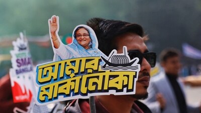 A student holds a placard of Prime Minister Sheikh Hasina as they celebrate the formation day of Bangladesh Chhatra League, the student wing of Bangladesh Awami League, at the University of Dhaka. (REUTERS)